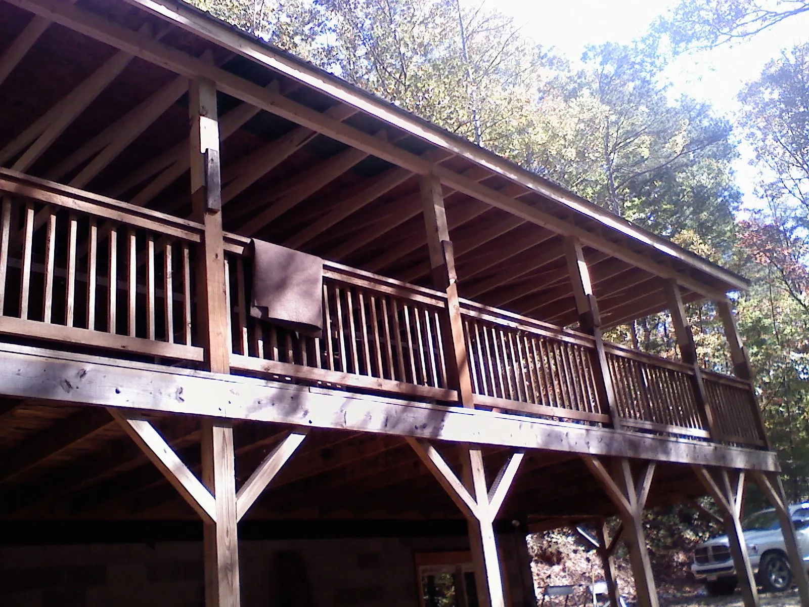 Timber framing under a new elevated porch and deck — Roof Leak Repair in Gracemont by Roofing Brothers